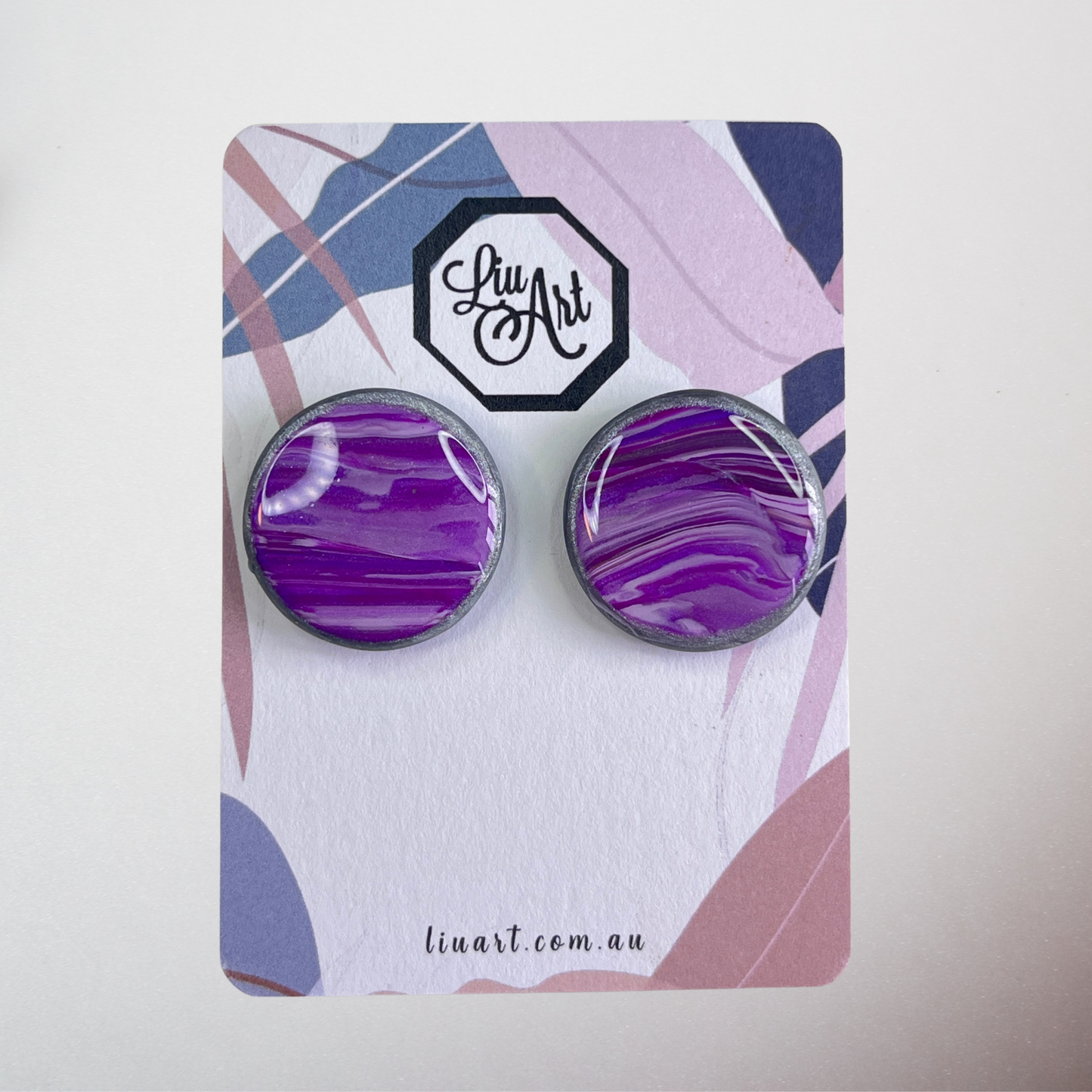 Purple marbled earrings on a branded card with 'Liu Art' logo.